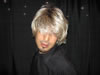 Paul tries on a wig at the York Women's Festival in York, PA